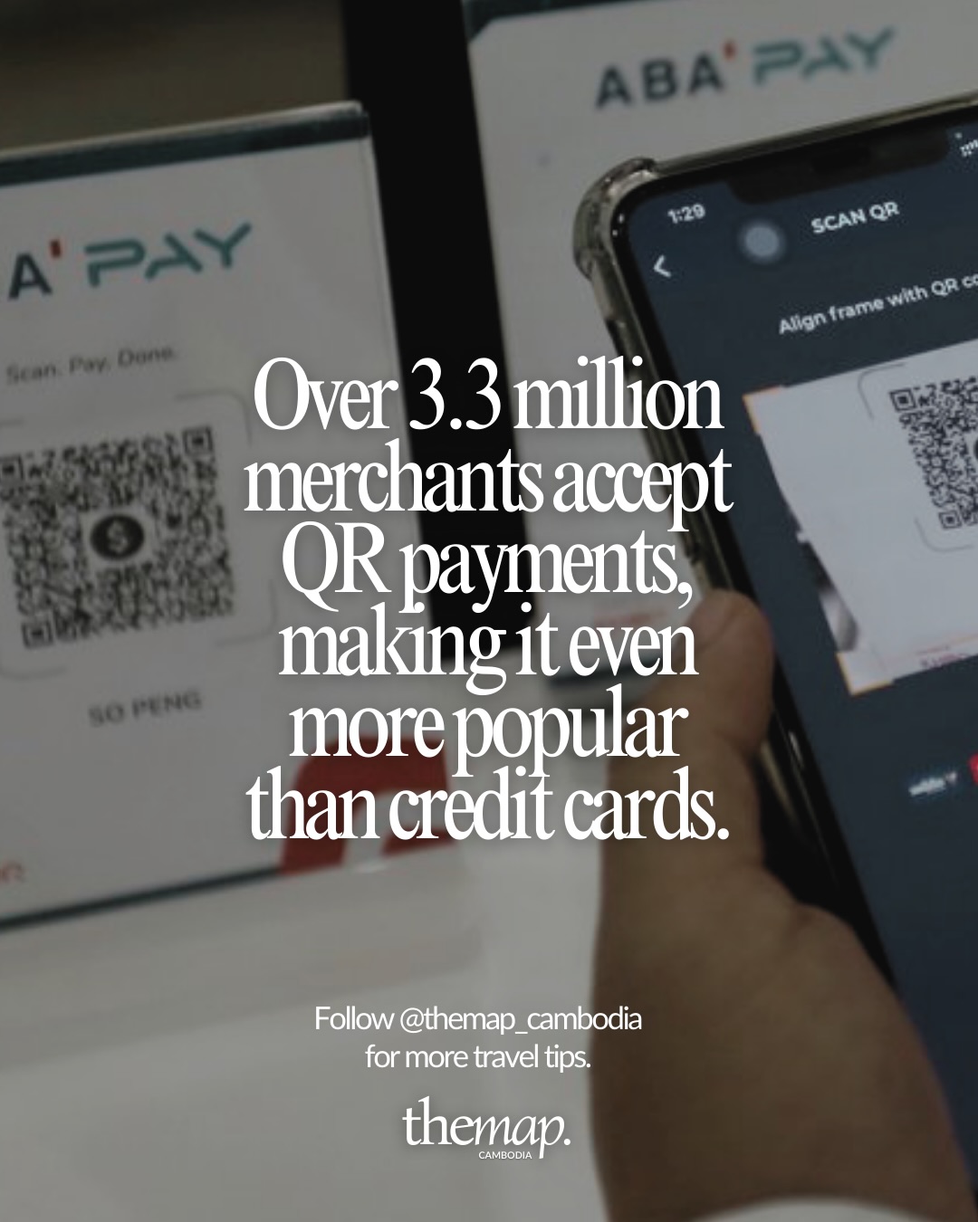 Scanning a QR code to pay at a counter with an ABA PAY stand in Cambodia