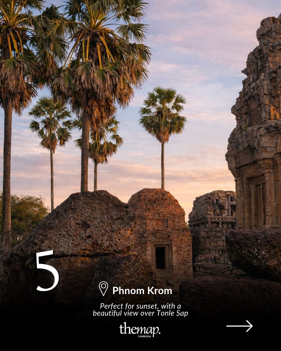 Sugar palms and weathered temple towers at Phnom Krom glowing at sunset