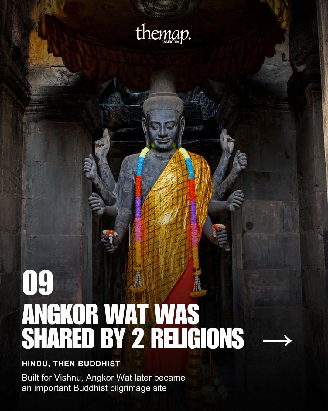 A religious statue draped in Buddhist robes inside Angkor Wat