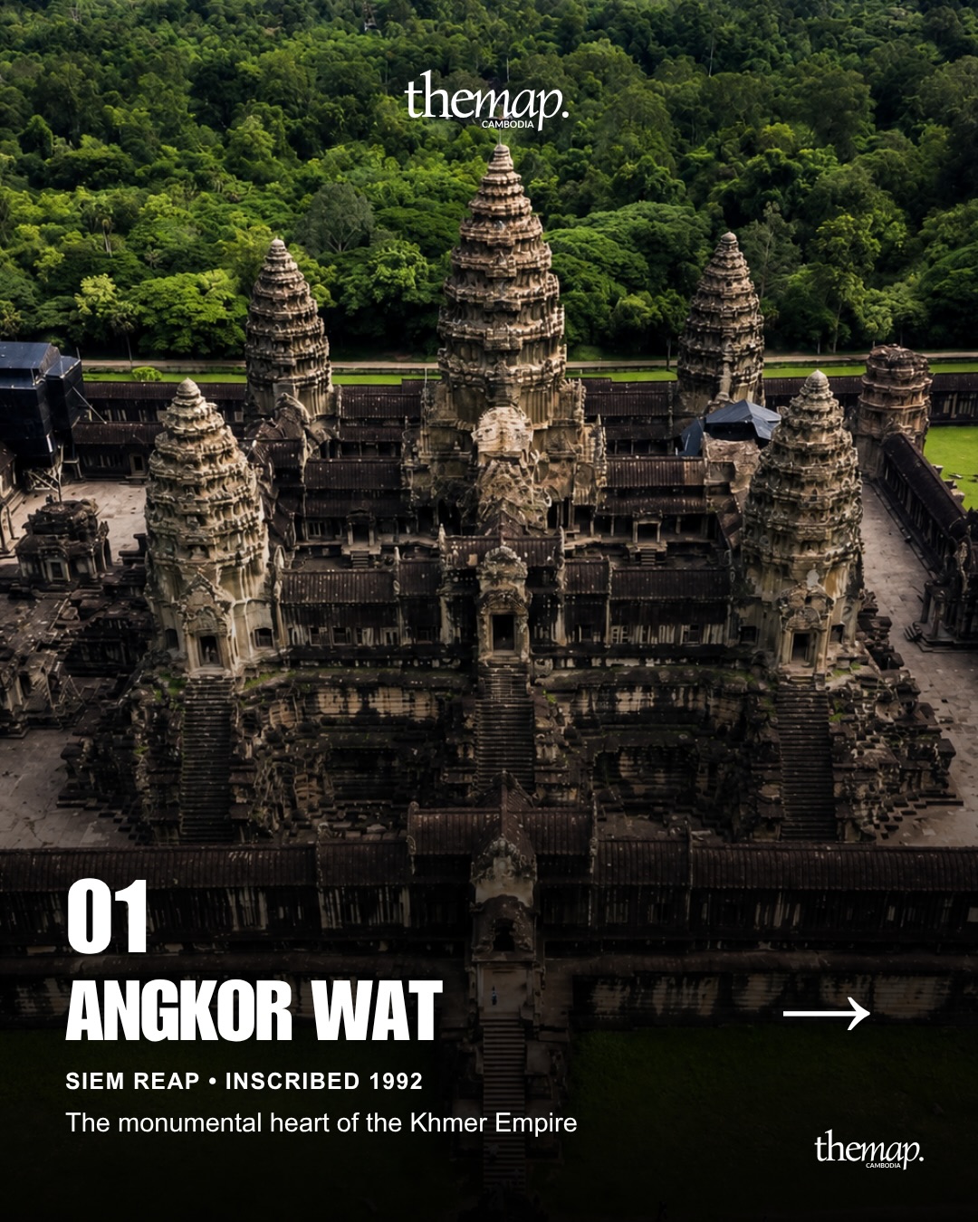 Aerial view of the towers and galleries of Angkor Wat with forest behind