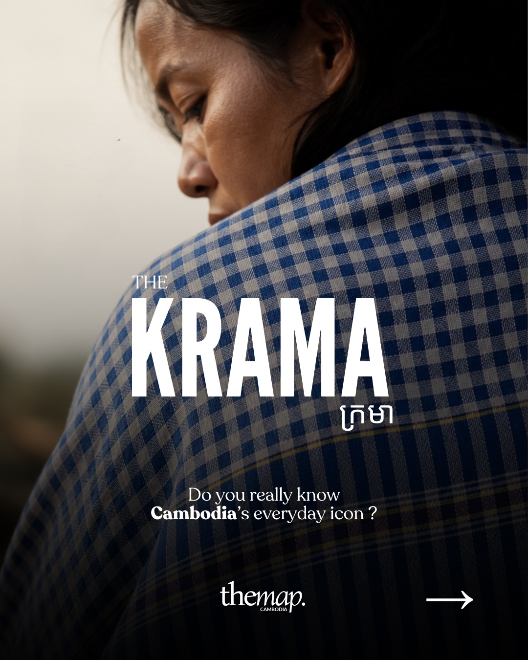 A woman wrapped in a blue checked krama