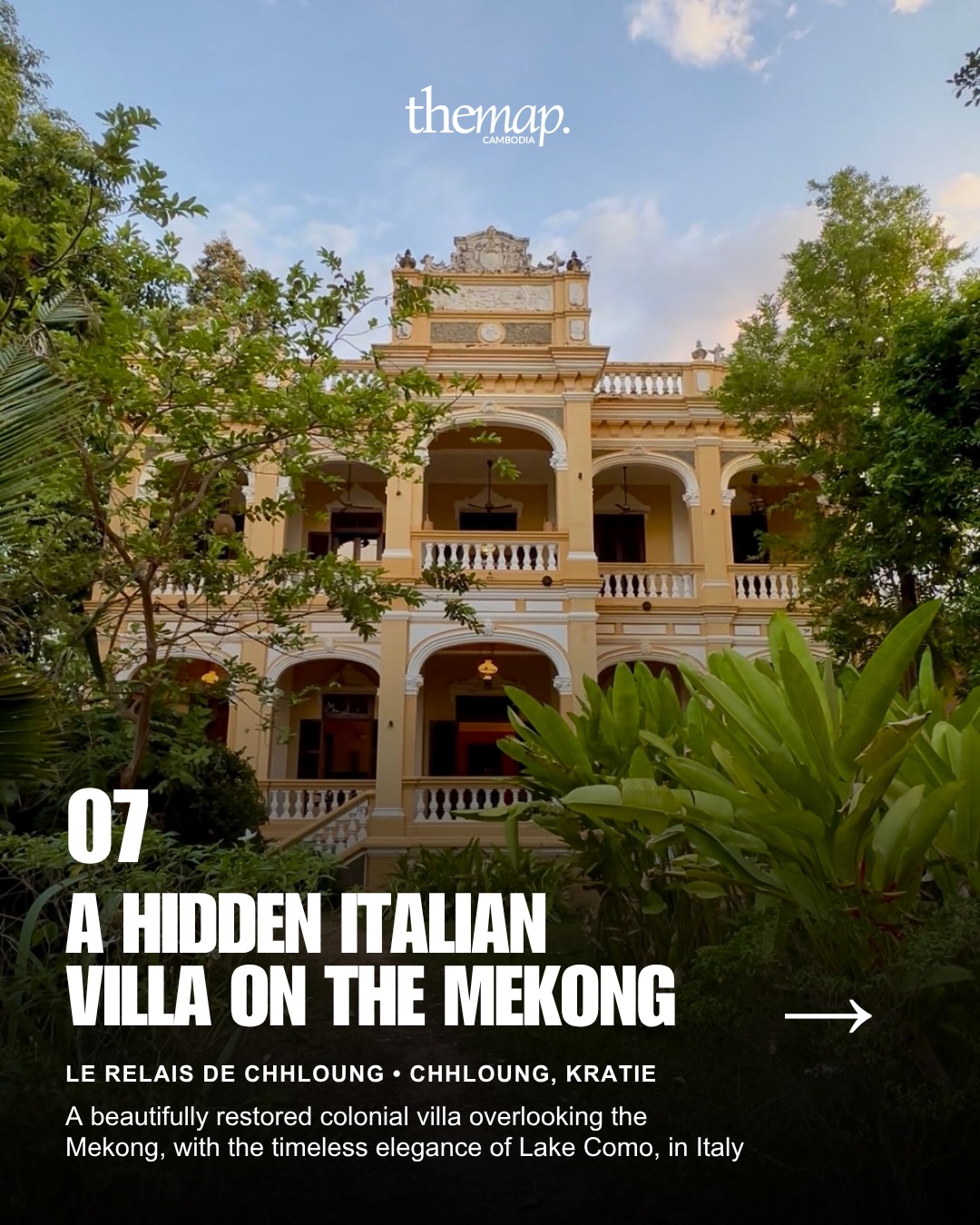 A restored ochre colonial villa with arcades and palms, overlooking the Mekong at Chhloung